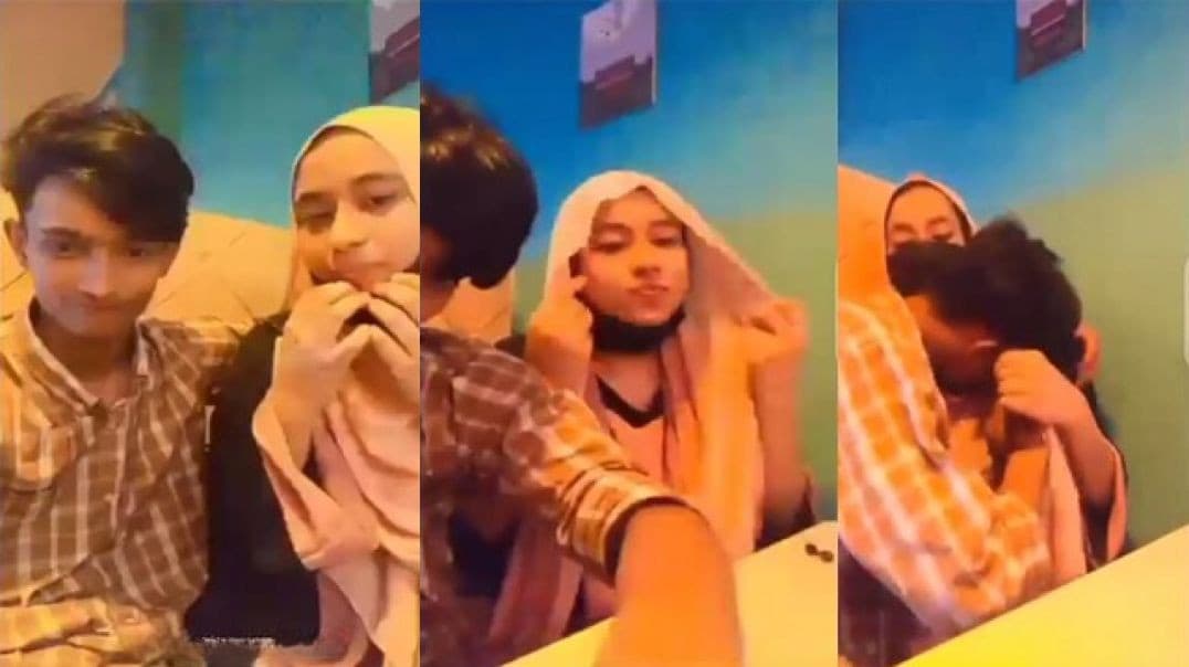 Restaurant Young Boy Enjoying With His Hijabi GF